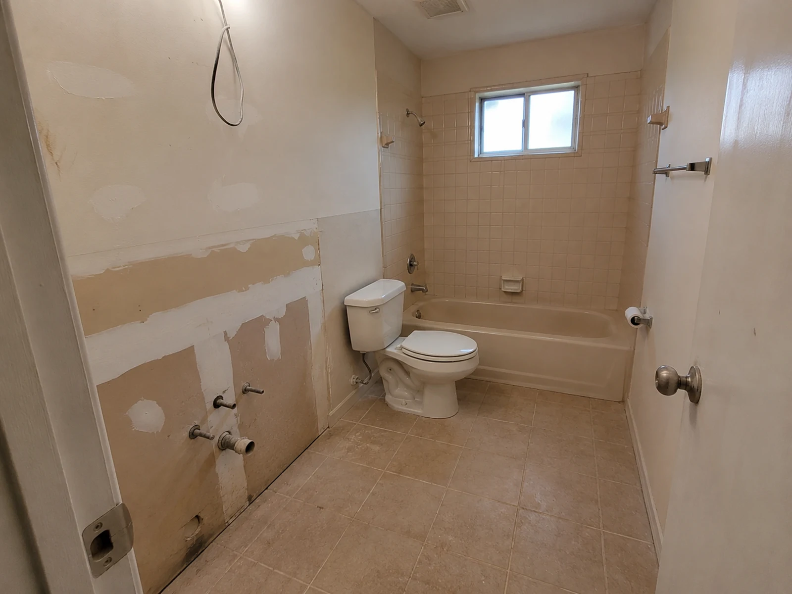 Unfinished bathroom before AI vanity and tile remodel concept