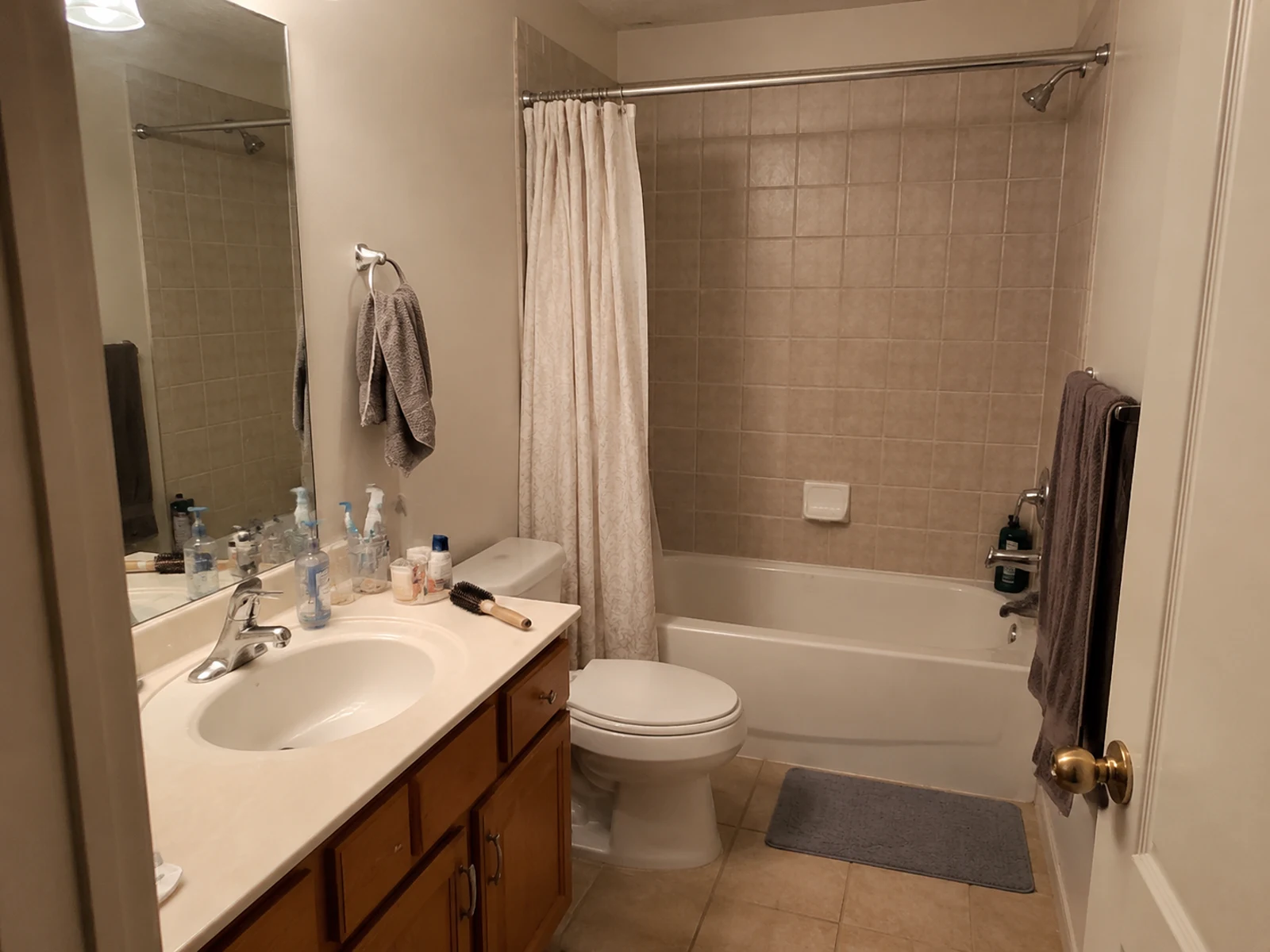 Small dated bathroom before AI storage and lighting design option