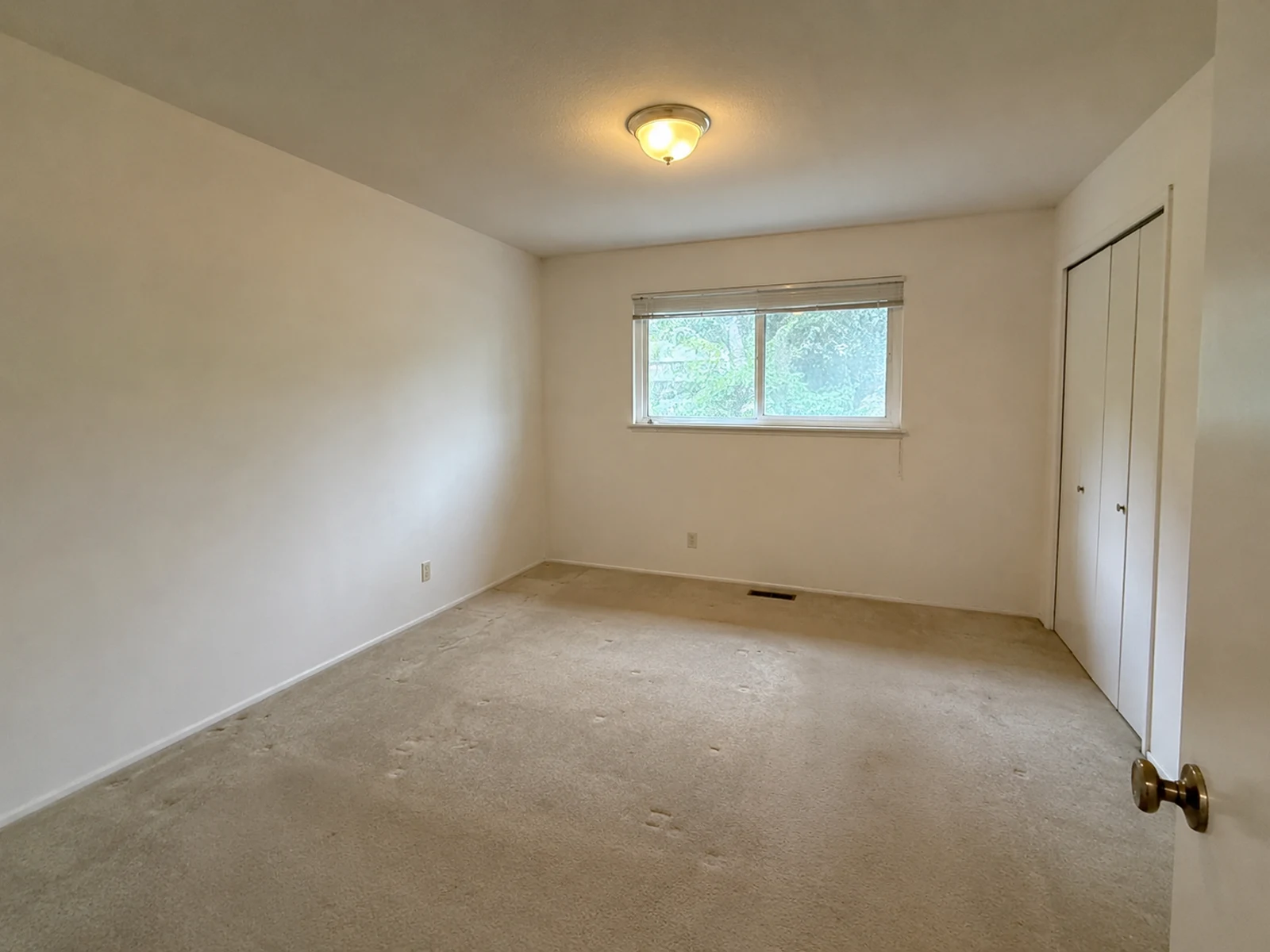 Empty primary bedroom before AI bedroom layout and palette concept